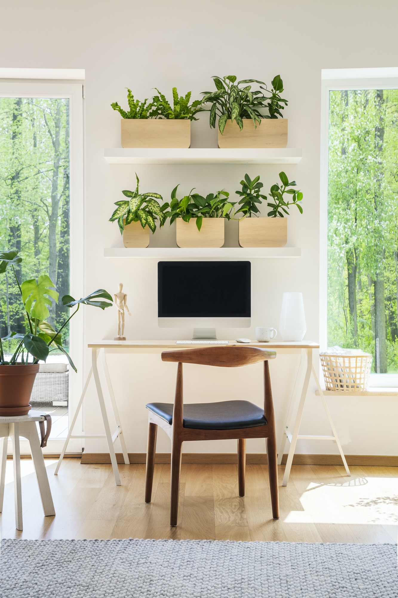 wooden-chair-at-desk-with-desktop-computer-in-bright-workspace-i